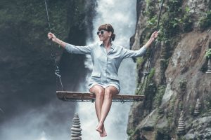 woman balancing on a swing